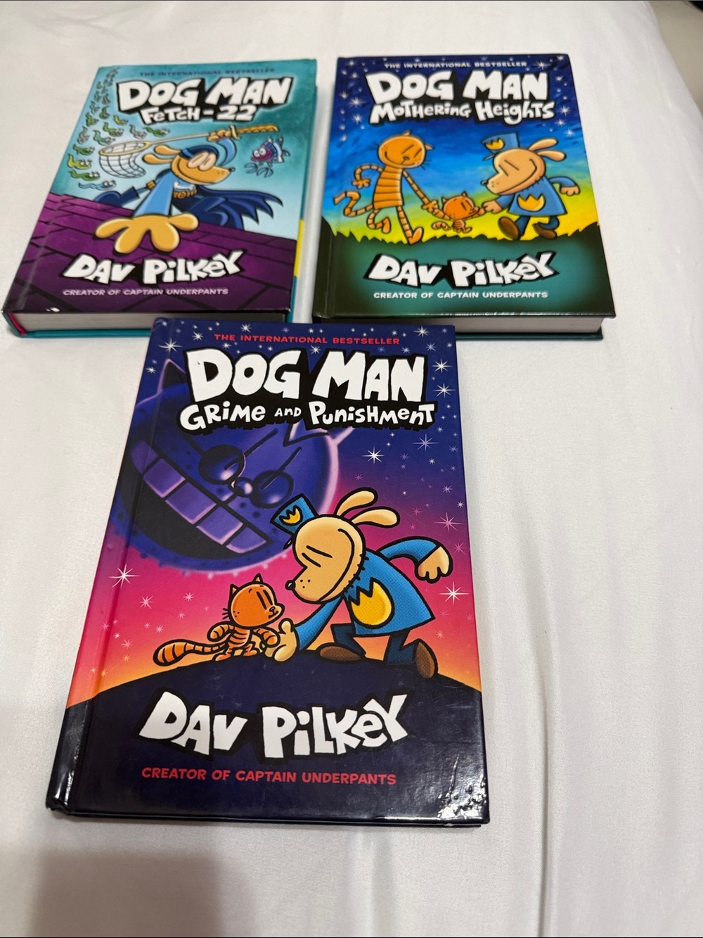Dog Man series by Dav Pilkey,  (3) hard cover books.